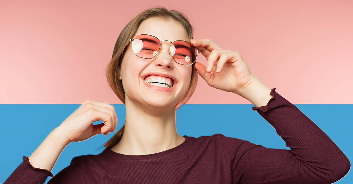 woman with sunglasses laughing